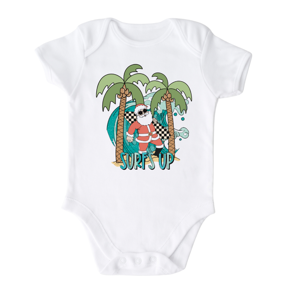 White Bodysuit with a funny Santa surfing graphic and the text 'Surf's Up' - perfect for adding some holiday cheer and beach vibes to their outfit.