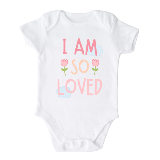 Short Sleeve White Onesie with a pastel graphic of the text 'I am so loved.' This heartwarming design represents the unconditional love surrounding your child. 