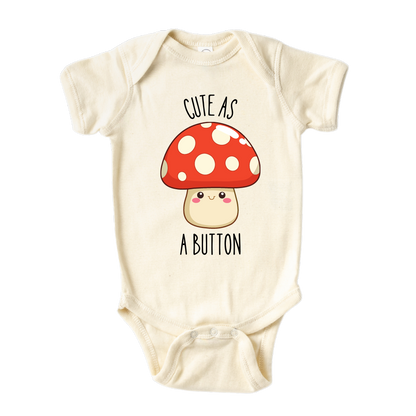 Natural Baby Bodysuit showcasing a cute printed graphic of a mushroom and the endearing text 'Cute As A Button.' Discover this delightful tee that adds a touch of charm and style to your child's wardrobe.