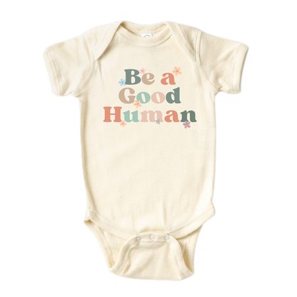 Natural Baby Bodysuit with retro printed graphic of 'Be A Good Human' text, promoting kindness and positivity. Shop now and inspire your little one to make a positive impact. Perfect addition to their stylish wardrobe.