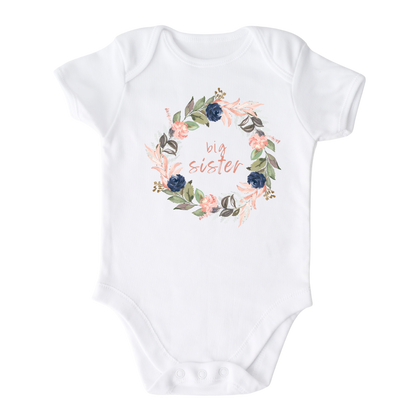 Baby Bodysuit with a cute printed graphic of a floral wreath and the text 'Big Sister.' This adorable t-shirt celebrates the special role of being a big sister. Made with high-quality materials, it offers comfort and durability, making it a perfect addition to any child's wardrobe.