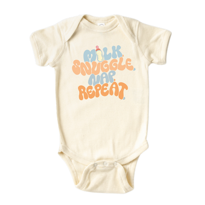 Natural Baby Bodysuit with a fun printed graphic and the text 'Milk Snuggle Nap Repeat.' This playful and cute design captures the essence of cozy and comforting moments. 