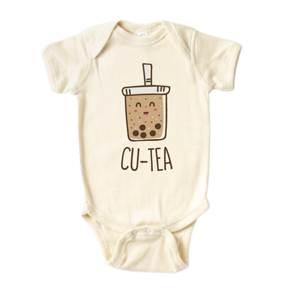 A kids' t-shirt with a charming graphic of a boba cup and the text 'Cu-tea.' The design captures the whimsical appeal of the popular tea drink and showcases the wearer's fondness for cuteness and trendy fashion.