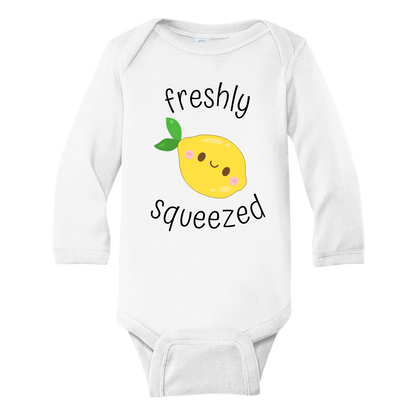 A kids' t-shirt with an adorable graphic of a cute lemon and the text 'Freshly Squeezed.' This design captures the refreshing and playful nature of the citrus fruit, adding a vibrant touch to the wearer's style. It's a delightful and eye-catching tee that stands out with its zestful charm.