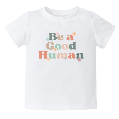 Kids t-shirt with retro printed graphic of 'Be A Good Human' text, promoting kindness and positivity. Shop now and inspire your little one to make a positive impact. Perfect addition to their stylish wardrobe.