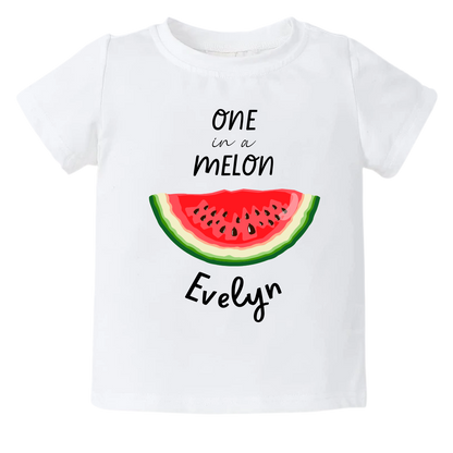 A delightful watermelon design on a kid's t-shirt and baby onesie, with the text 'On In A Melon.' The design can be personalized with customizable names, adding a touch of summer fun and sweetness to the outfit.