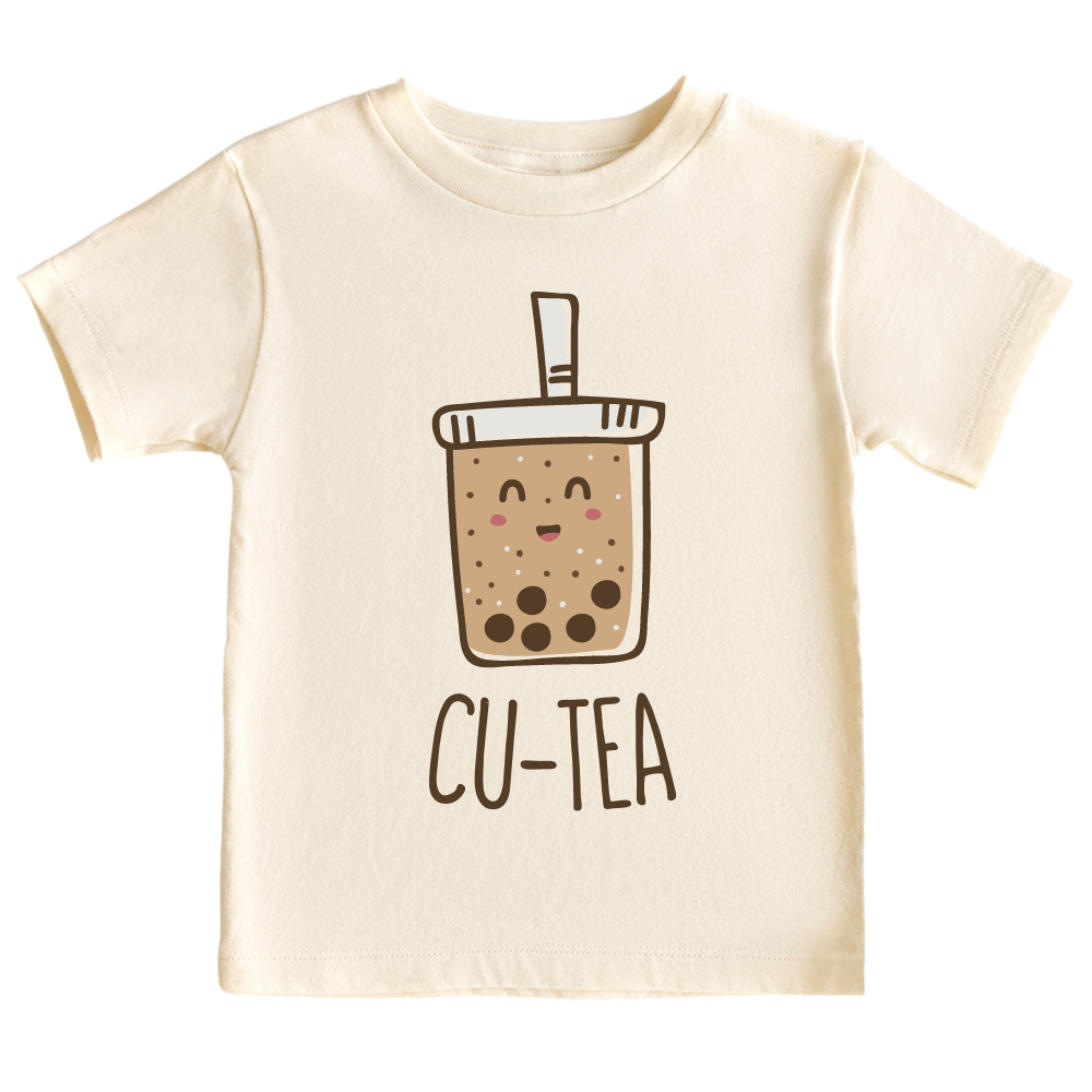 A kids' t-shirt with a charming graphic of a boba cup and the text 'Cu-tea.' The design captures the whimsical appeal of the popular tea drink and showcases the wearer's fondness for cuteness and trendy fashion.