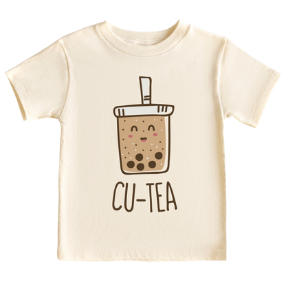 A kids' t-shirt with a charming graphic of a boba cup and the text 'Cu-tea.' The design captures the whimsical appeal of the popular tea drink and showcases the wearer's fondness for cuteness and trendy fashion.