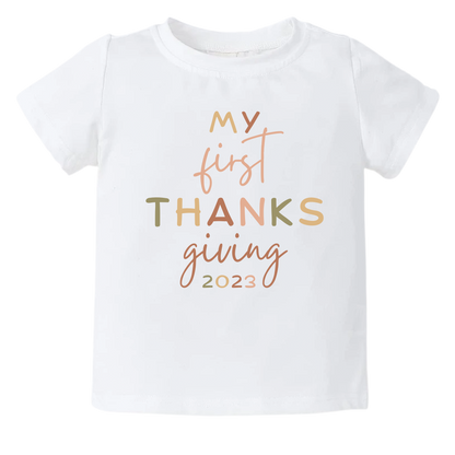 Kid's t-shirt with cute 'My First Thanksgiving' text design.