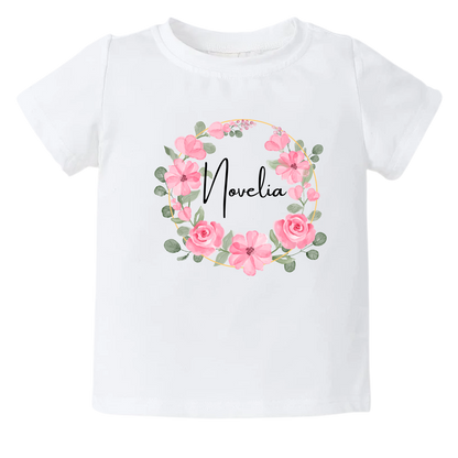 Kid's t-shirt with a cute pink floral wreath design, customizable with names.