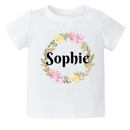 Kid's t-shirt with a cute flower wreath design, customizable with names.