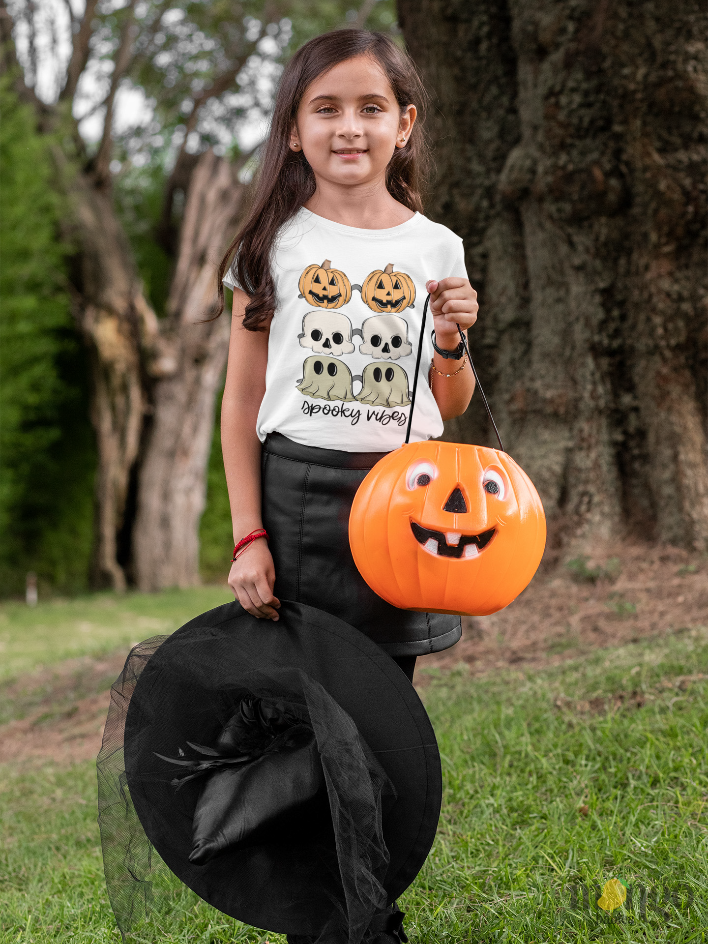 Kid's t-shirt with a cute Halloween icons design and 'Spooky Vibes' text.